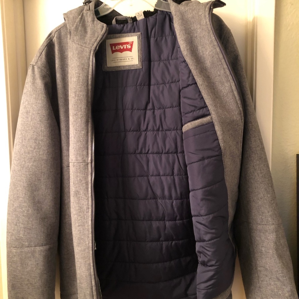 Levi coat with hood ,like new .fur lined .